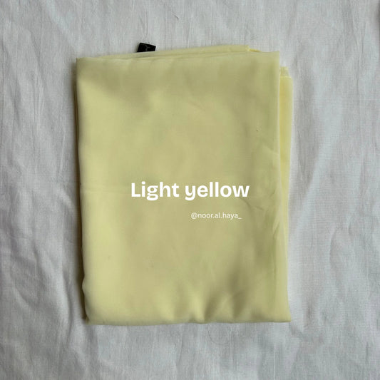2 meter heavy Malaysian chiffon hijab in light yellow by Noor Al Haya