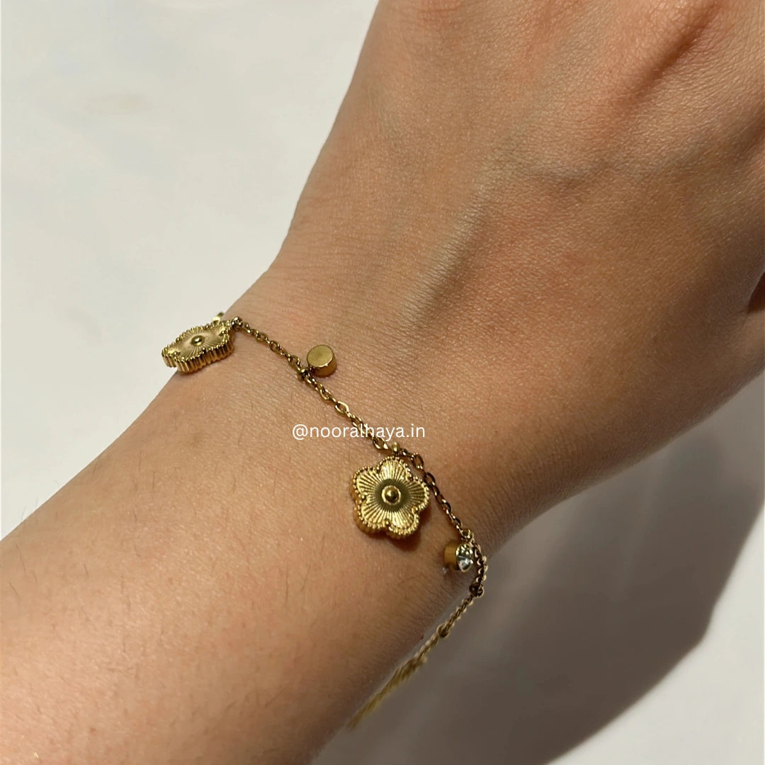 Woman wearing a Golden Bloom Bracelet by Noor Al Haya