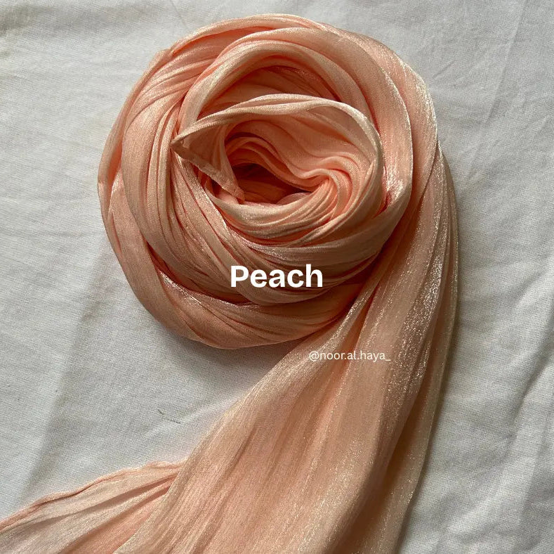 2 meter peach shimmer organza hijab by Noor Al Haya