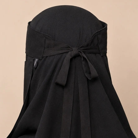 a model wearing 7-12 saudi niqab by noor al haya