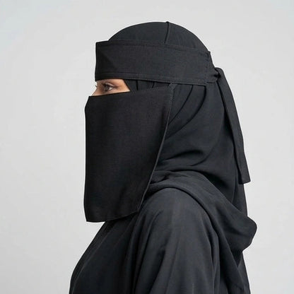 a women wearing 9'12 saudi niqab by noor al haya