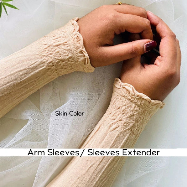 a women weraing beige arm sleeves by noor al haya 