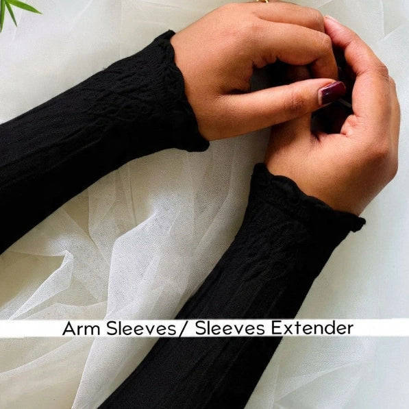 a women weraing black arm sleeves by noor al haya 