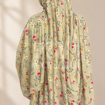 a model wearing brown floral printed hijab by noor al haya