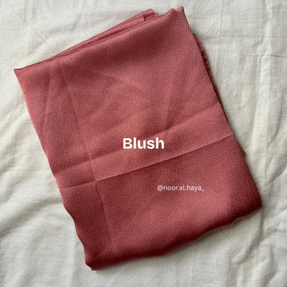 Bubble satin hijab in blush by Noor Al Haya