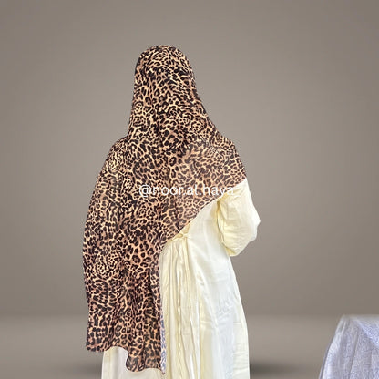 a women wearing cheetah print hijab by noor al haya