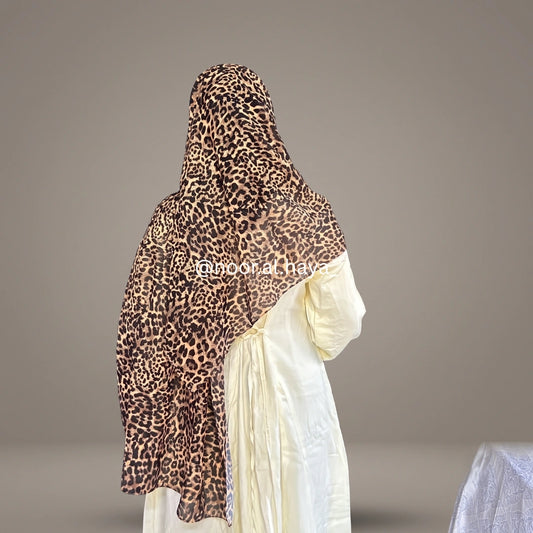 a women wearing cheetah print hijab by noor al haya
