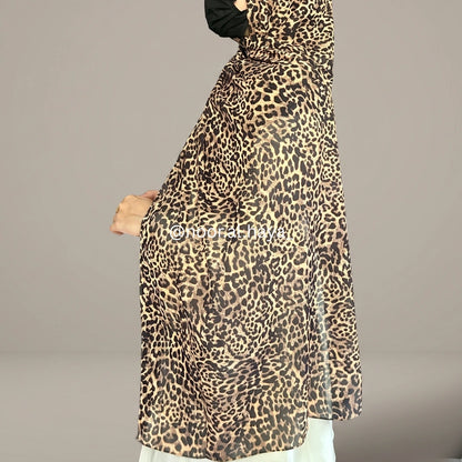 a women wearing cheetah print hijab by noor al haya
