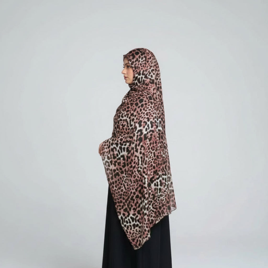 modal wearing wearing classic leopard  print hijab by noor al haya