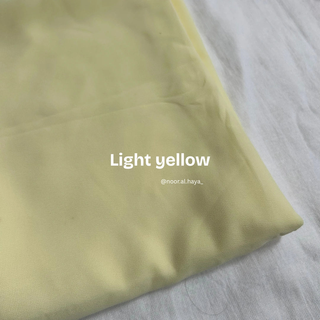2 meter heavy Malaysian chiffon hijab in light yellow by Noor Al Haya