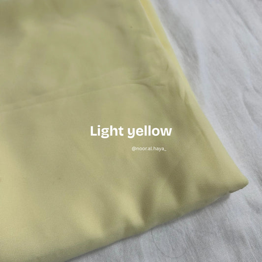 2 meter heavy Malaysian chiffon hijab in light yellow by Noor Al Haya
