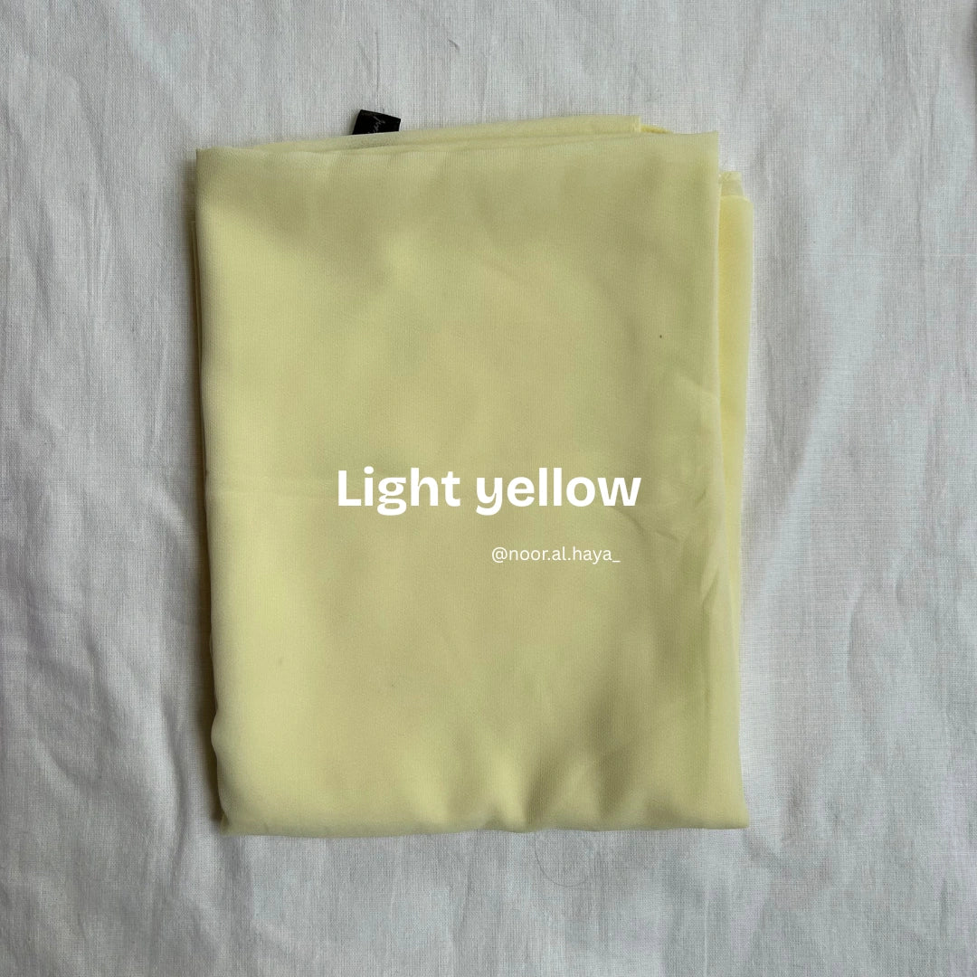 2 meter heavy Malaysian chiffon hijab in light yellow by Noor Al Haya