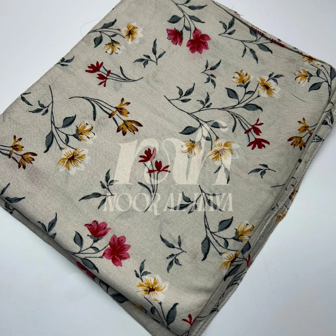 a close up photo ofice white floral printed hijab by noor al haya