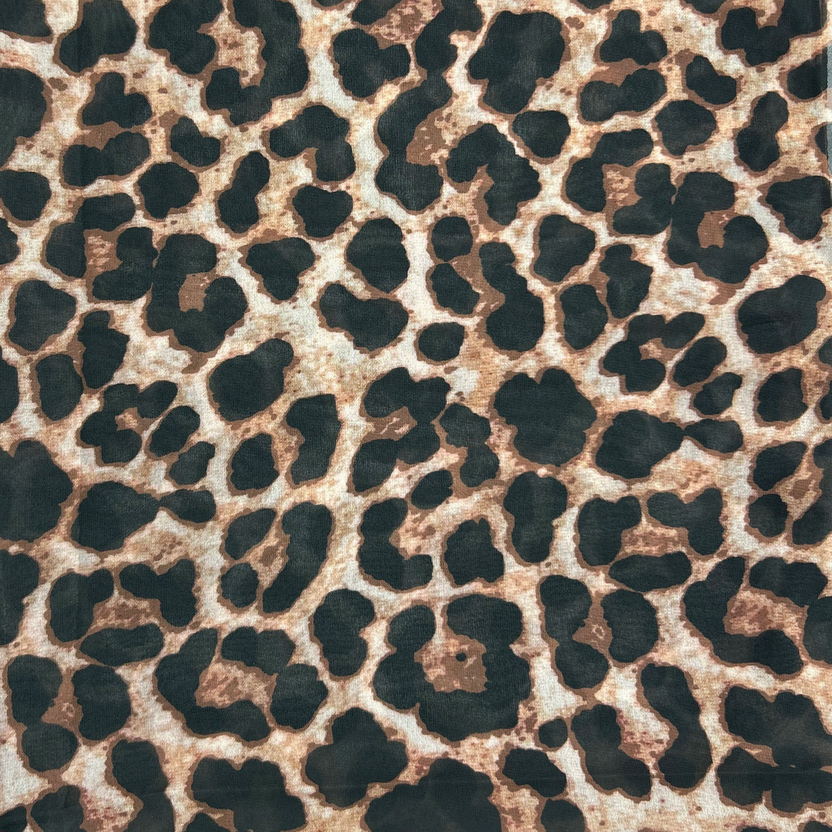 close up of leopard print chiffon hijab by noor al haya