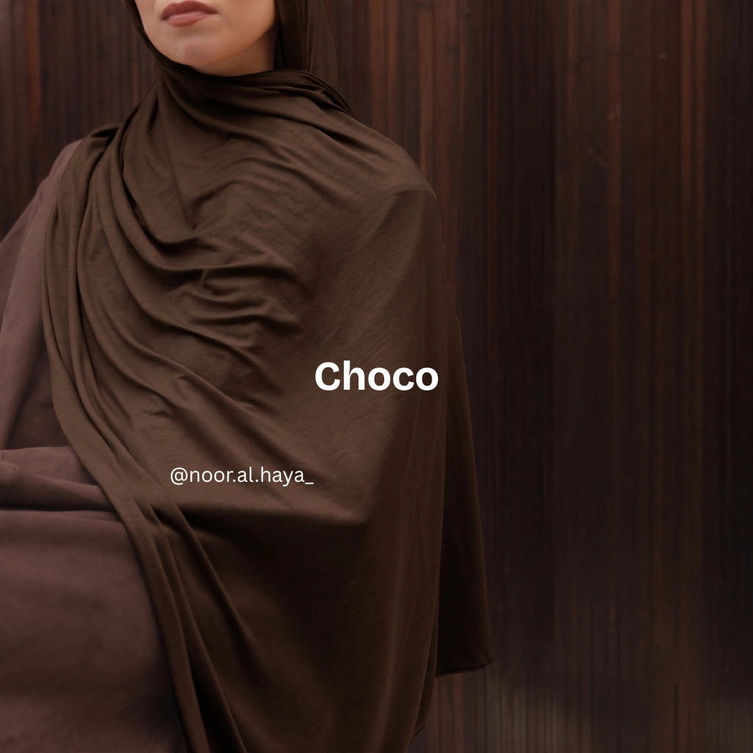 a women wearing choco luxe jersey hijab by noor al haya