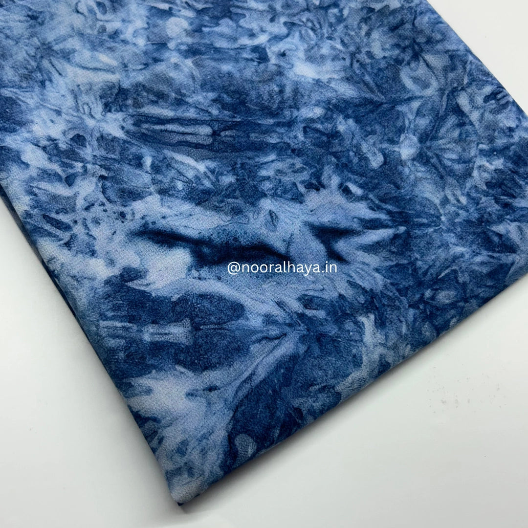 a close up shot of  blue waterclour hijab by noor al haya