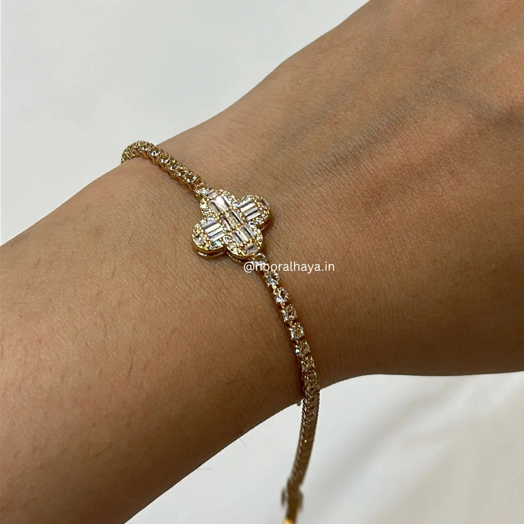Woman wearing a Clover Charm Bracelet by Noor Al Haya