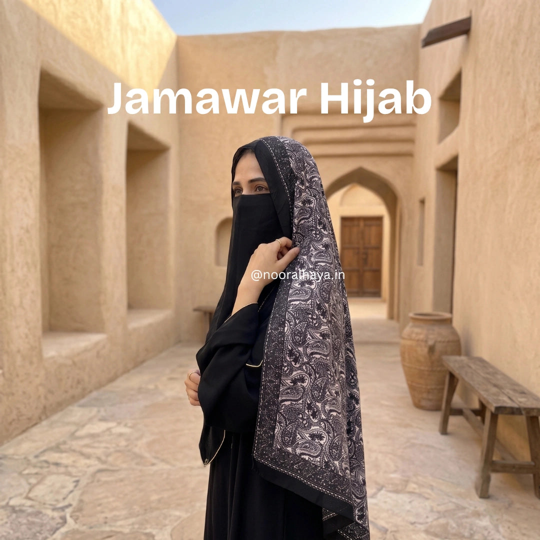 a model wearing black jamawar hijab by noor al haya