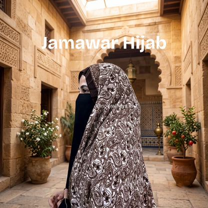 a model wearing jamawar hijab by noor al haya
