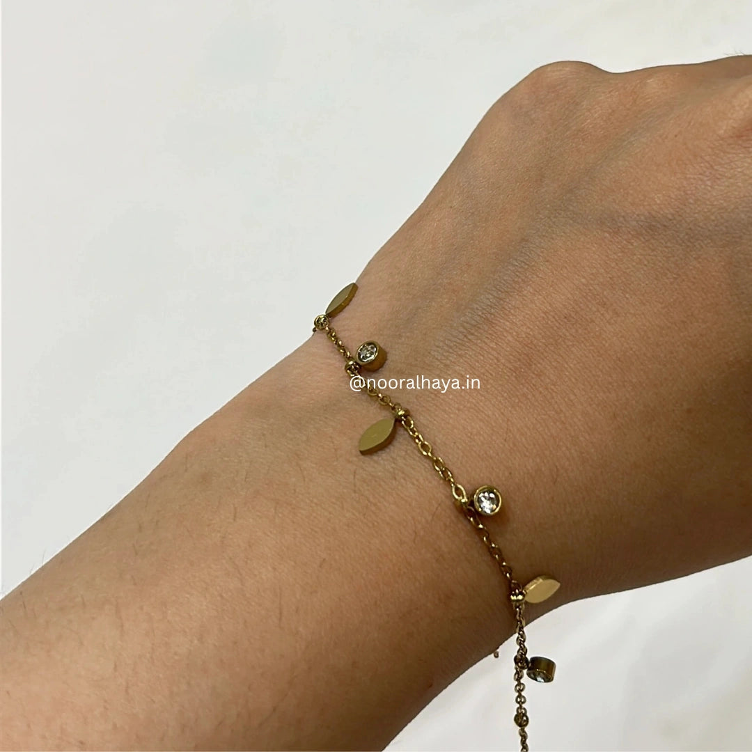 Woman wearing a leaf stone bracelet by Noor Al Haya