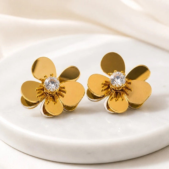 a Noor Floral Earrings on display by Noor Al Haya