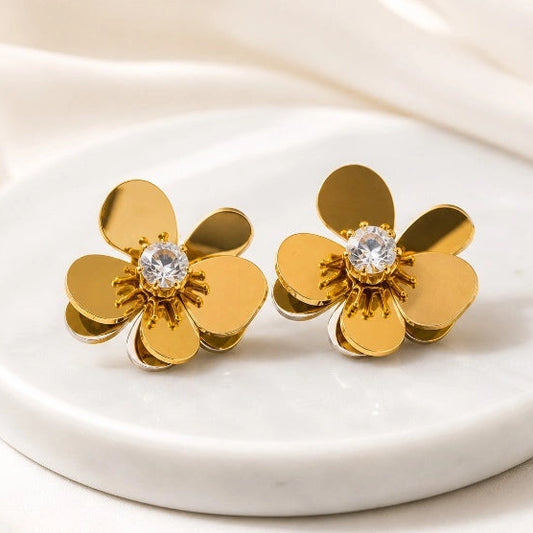 a Noor Floral Earrings on display by Noor Al Haya
