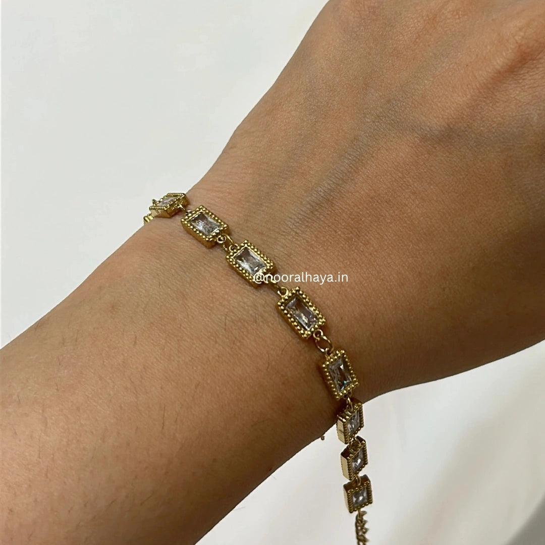 Woman wearing a rectangle stone bracelet by Noor Al Haya