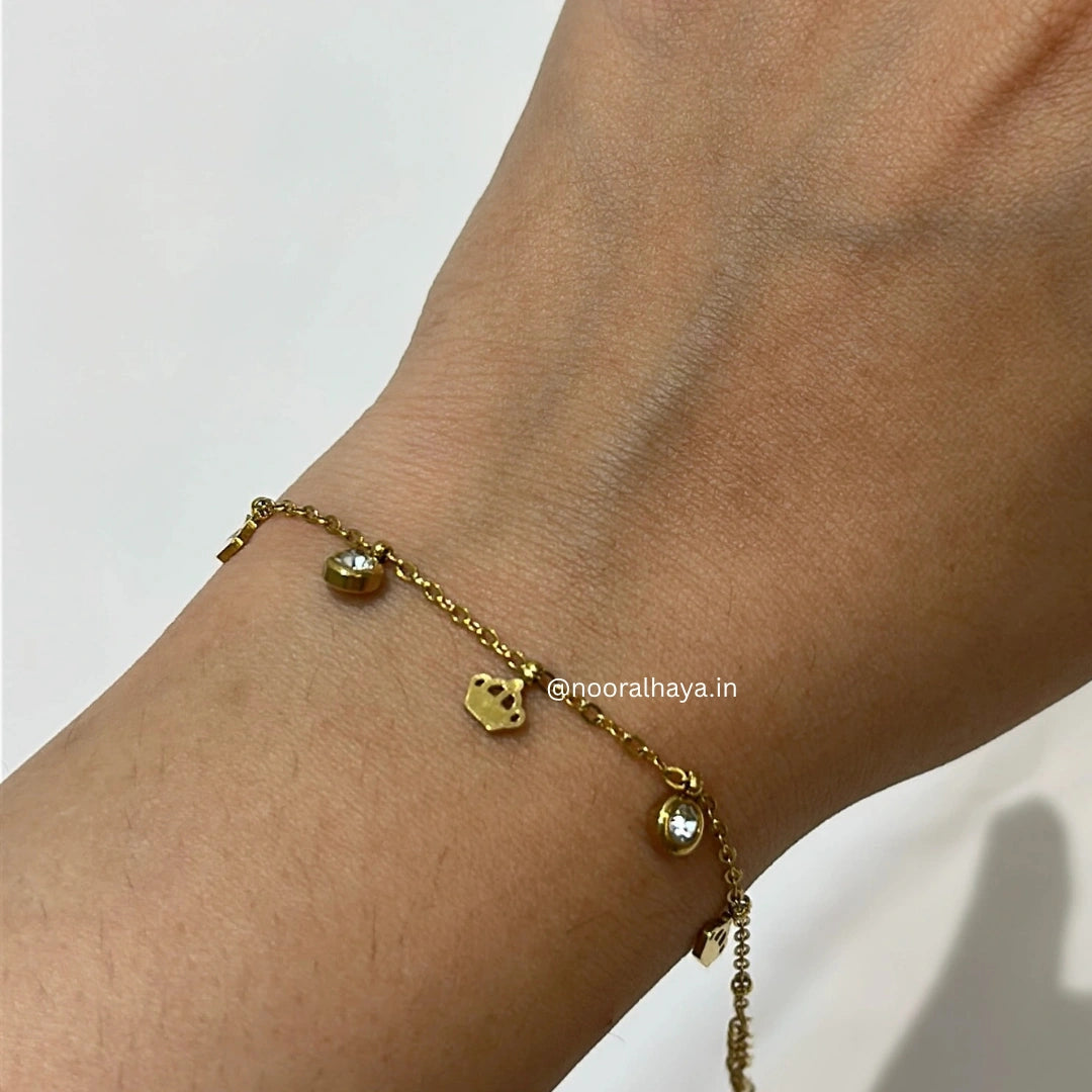 Woman wearing a stone crown bracelet by Noor Al Haya