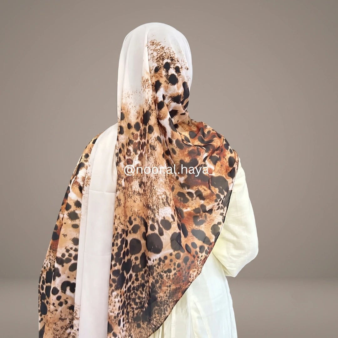 a women wearing tiger print hijab by noor al haya