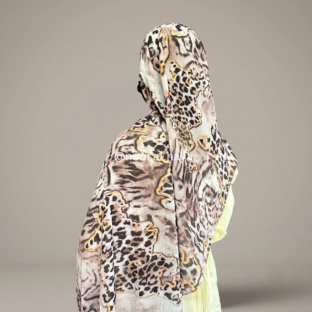 a women wearing wild leopard print hijab by noor al haya