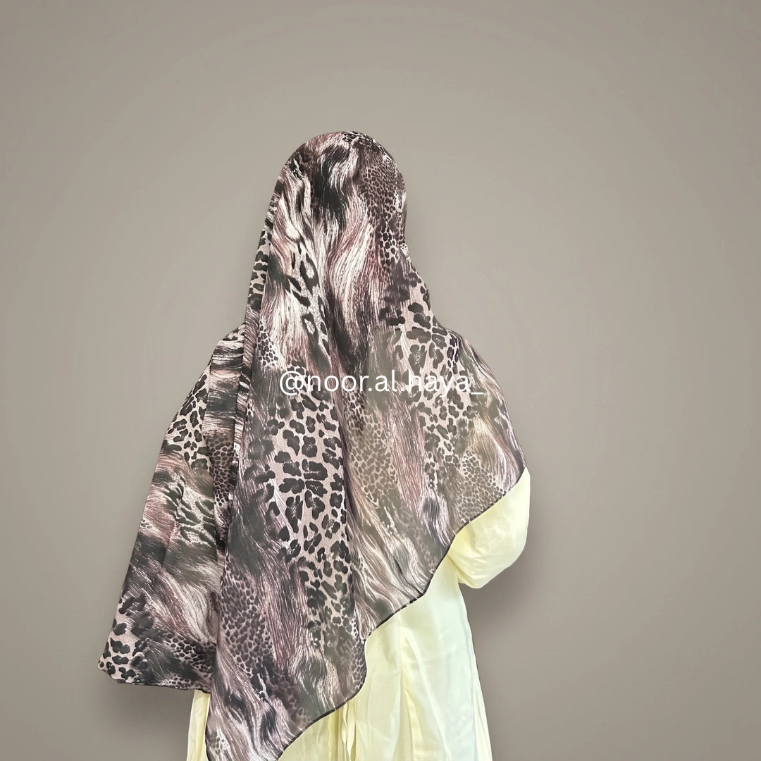 A woman wearing a wildcat animal print hijab by noor al haya